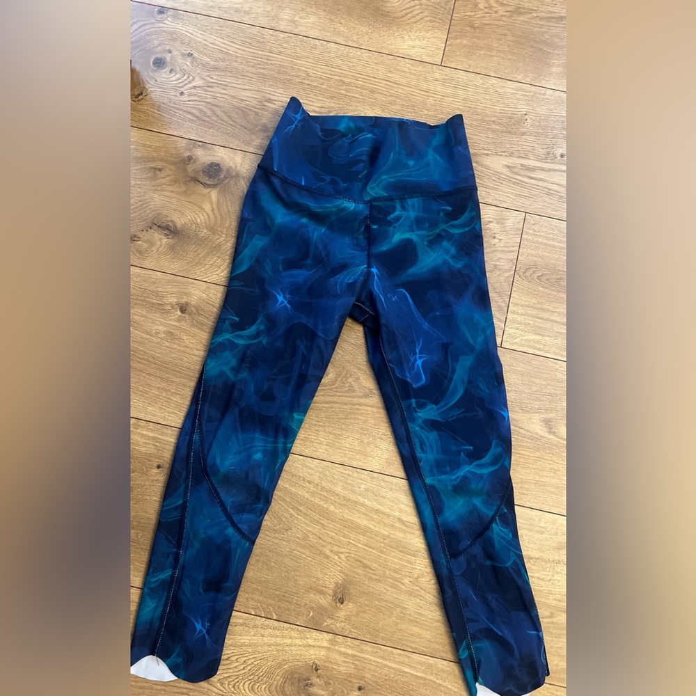 Cute swirling colored leggings without hem design. All in motion size 10-12.